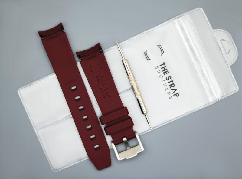 Back of the Dark red MoonSwatch strap and packaging of The Strap Brothers
