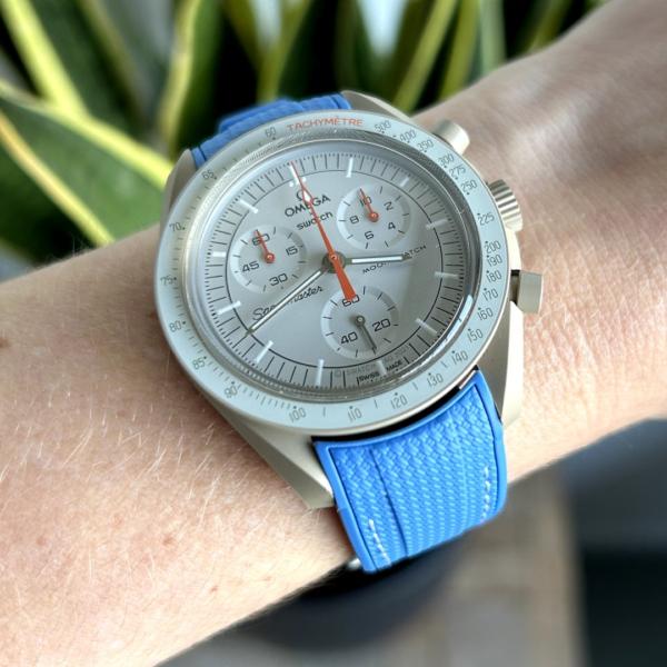 front view moonswatch jupiter with blue strap