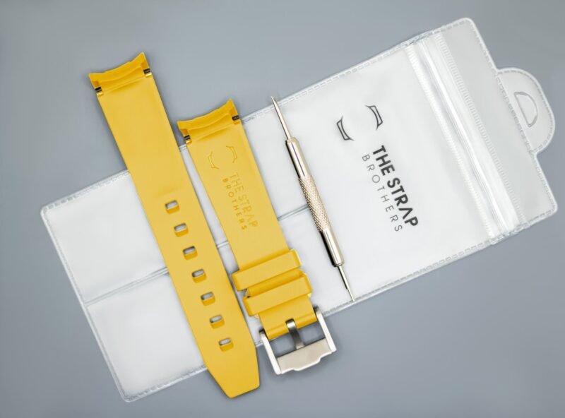 Back of the Yellow MoonSwatch strap and packaging of The Strap Brothers