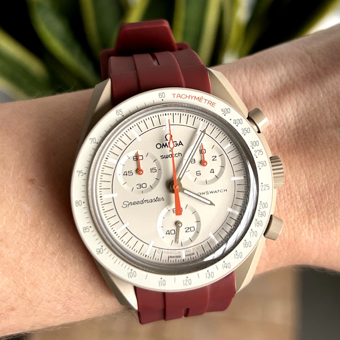 moonswatch jupiter with red replacement strap