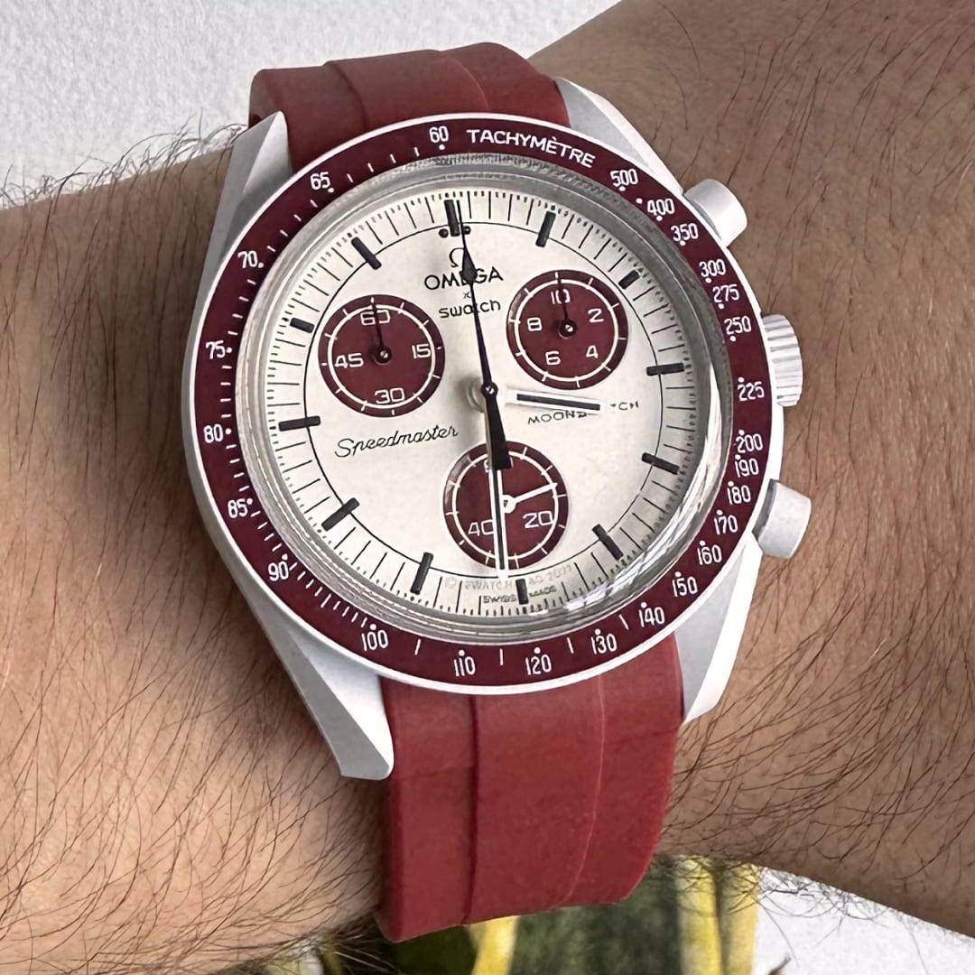 MoonSwatch pluto with red replacement strap